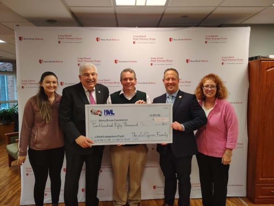 Maple Family Centers pledges $250K to support veterans home Stony Brook Maple Big Check