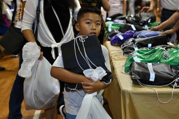 Nonprofit donates backpacks and clothing items, pledges education programs for local students Classroom Of Change Kid